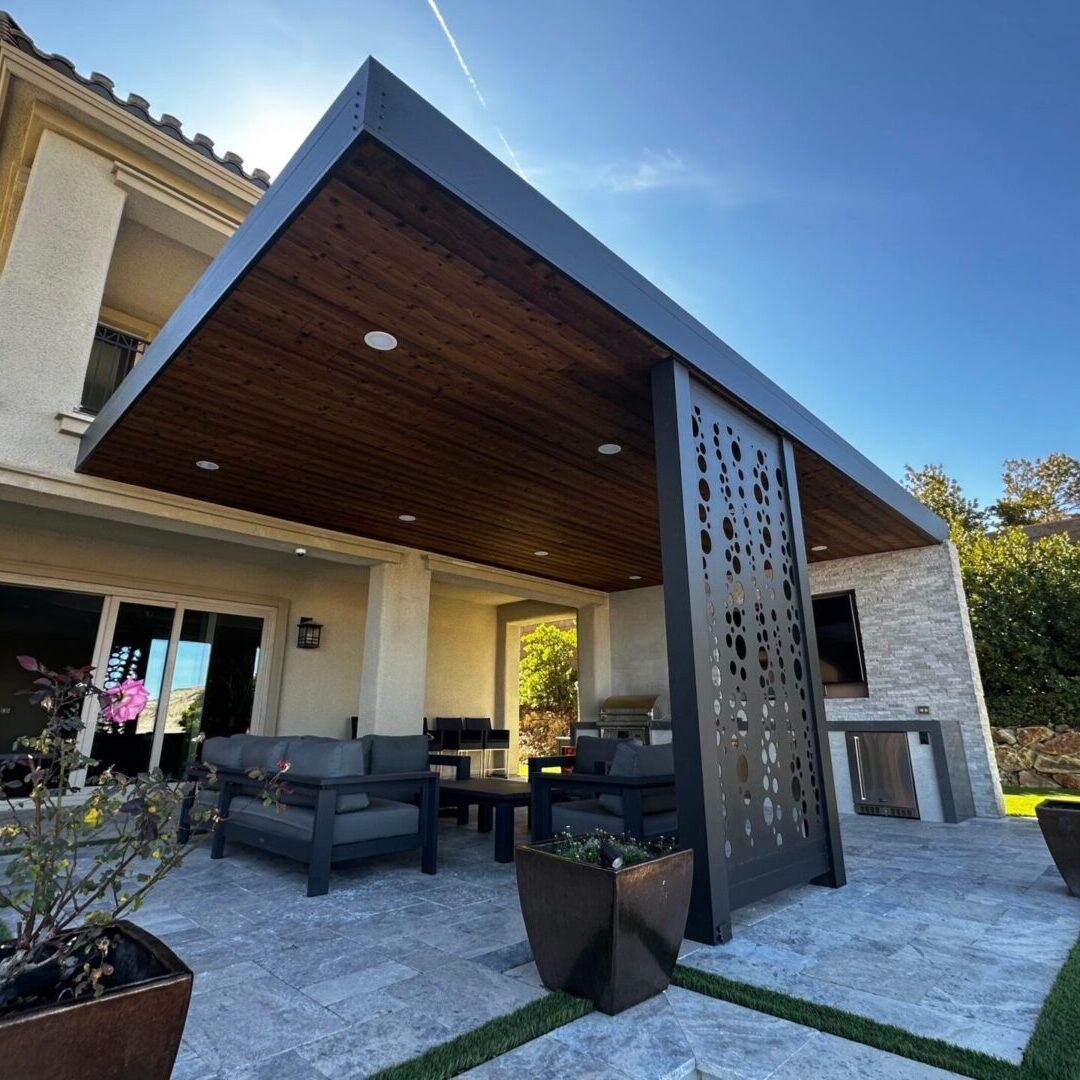 Modern covered patio with wooden ceiling and seating